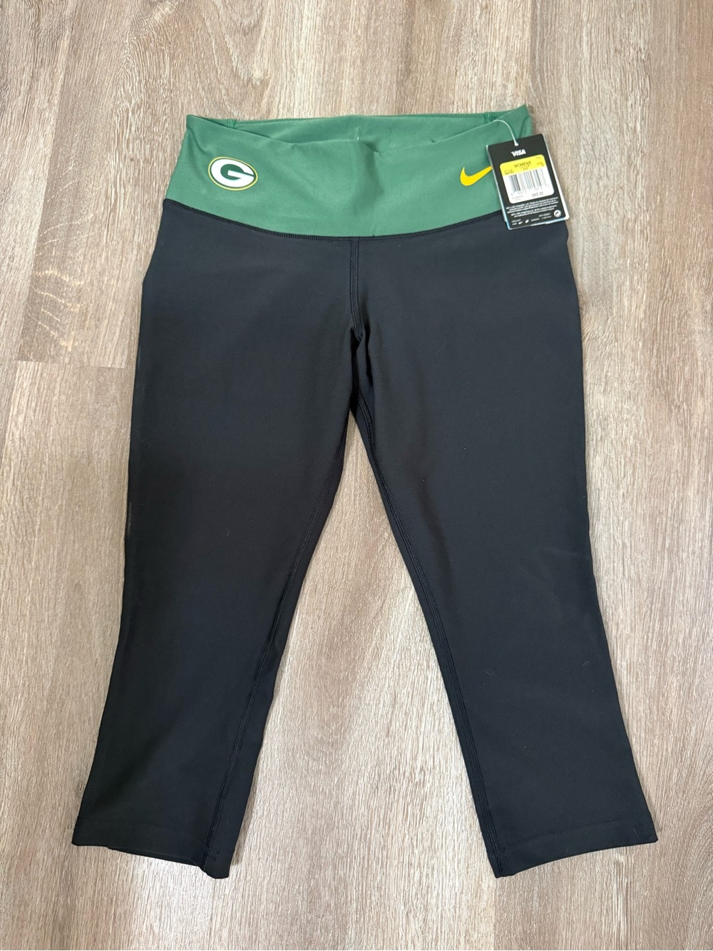 Nike Kids Black Capri Leggings with Green Waistband and Yellow Swoosh